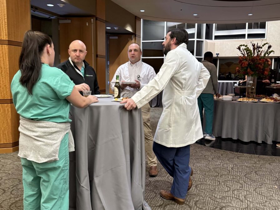 group of people talking around a table in the lobby