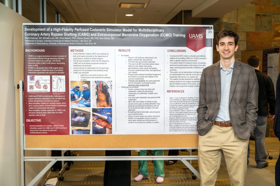 Elliot Radovan standing with his presentation