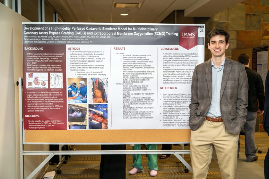 Elliot Radovan standing with his presentation