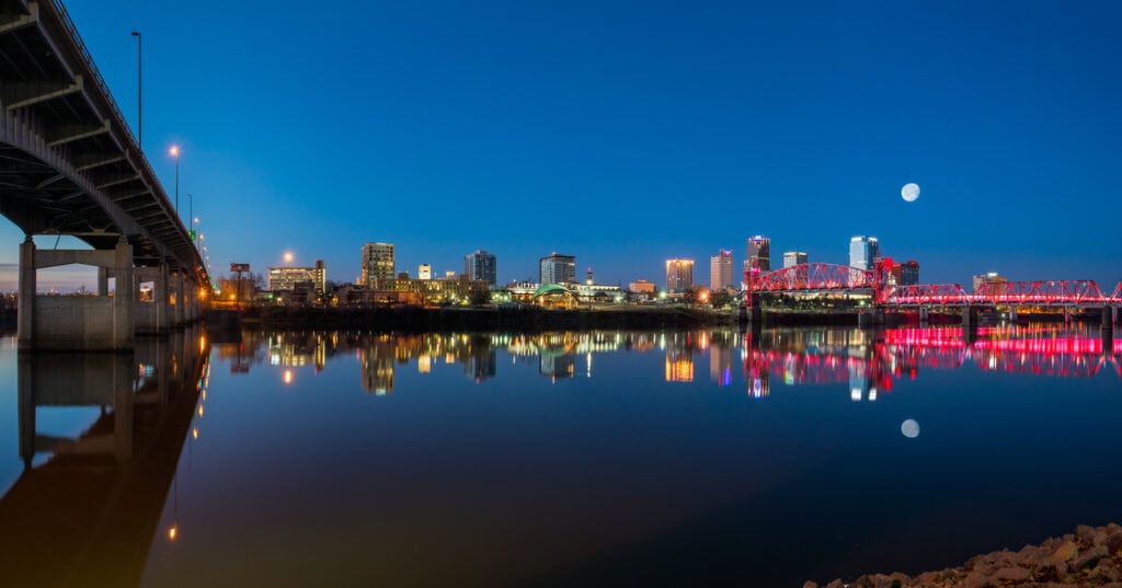 This photograph was taken in 3 parts to catch the moon setting over the city of Little Rock while the river bridges were still showing their night lighting.