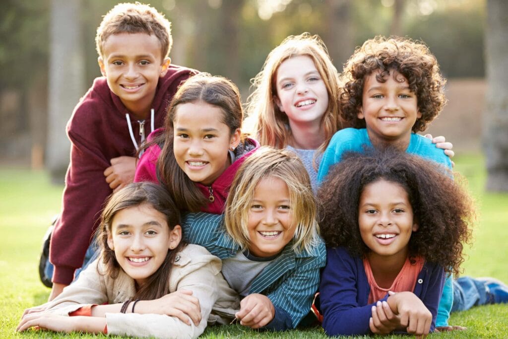 a group of kids stacked on top of each other