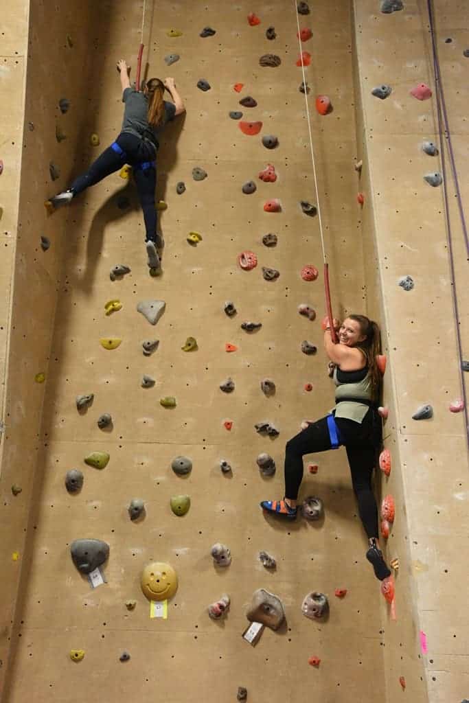 Two students climbing