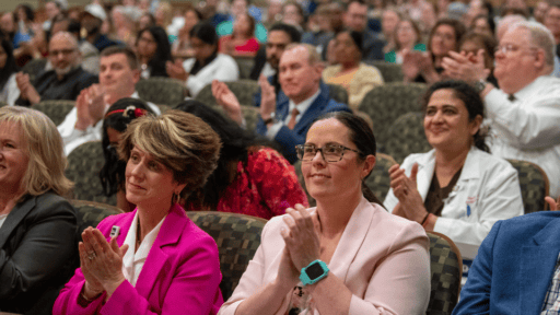 Faculty in audience applauding honorees at 2024 Dean's Honor Day ceremony