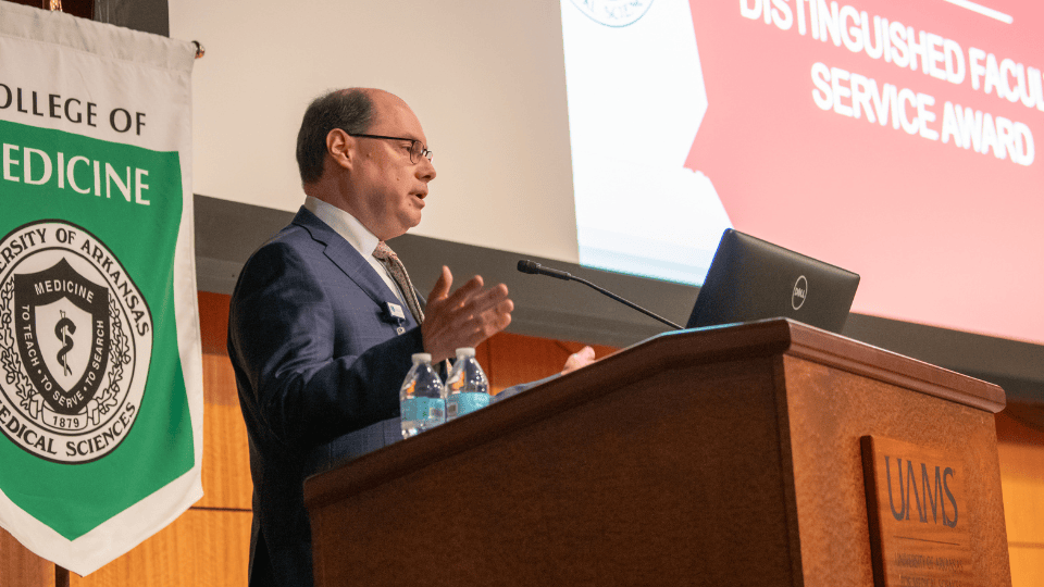 Eduardo Ochoa Jr., M.D., at podium at ceremony