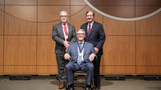 Dr. Tom Lanford surrounded by Dr. Barnes and Dr. Webber