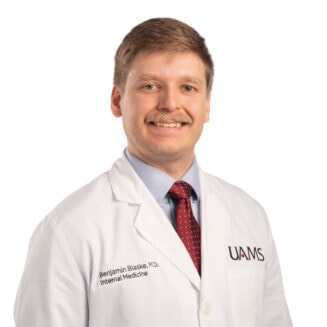 white male doctor in a white coat