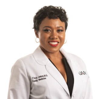 black female doctor in a white coat