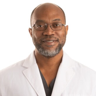 black male doctor in a white coat