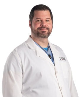 male physician in a white coat