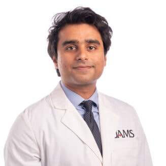 Mohammad Fhad Salam in a white coat