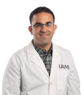 Male physician in a white coat