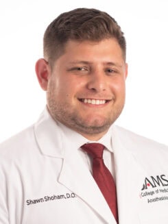male physician in a white coat