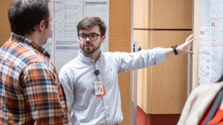 COM student James Andrews presents at the 2025 Student Research Day.