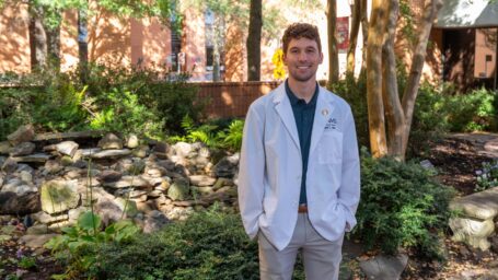 A college of medicine student standing outside of UAMS