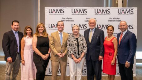 Ronnel family members posing with UAMS administration